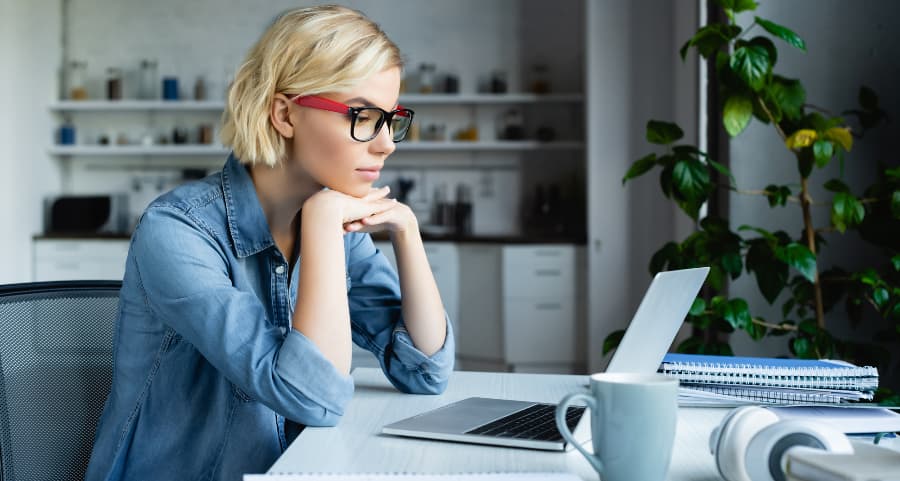 Young professional using laptop computer in home office